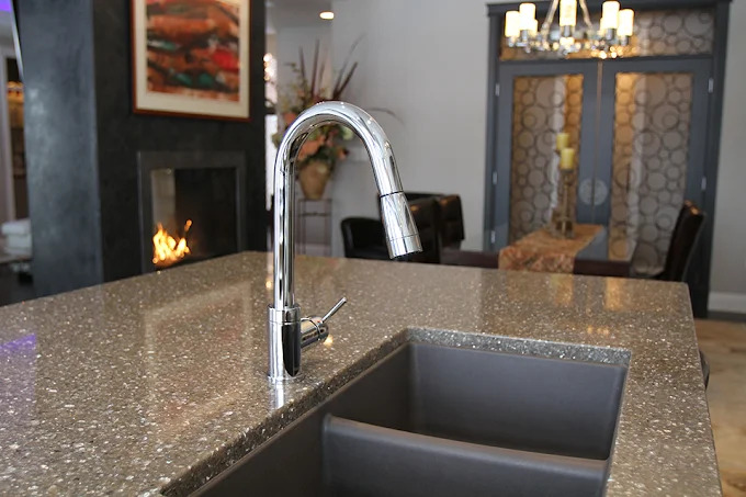 A shimmering grey engineered-quartz island